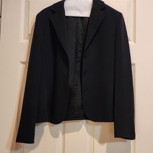 Black suit jacket with detailed atiching on collar and lapel
